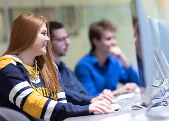 Students work at computers