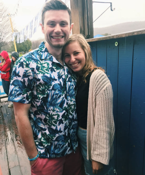 Samantha and Anthony smiling together as students.