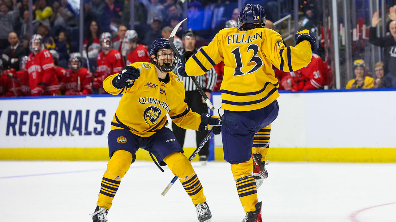 Men's ice hockey players celebrate heading to the Frozen Four.