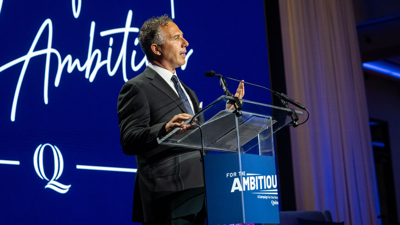 Chuck Saia speaking at the podium