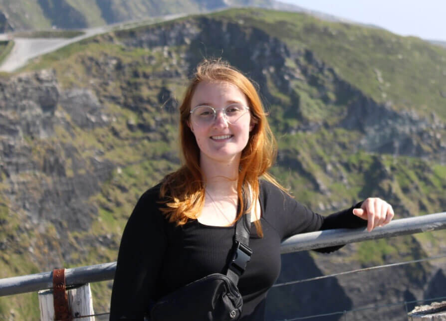 Lauren Jerram smiling against a beautiful green landscape