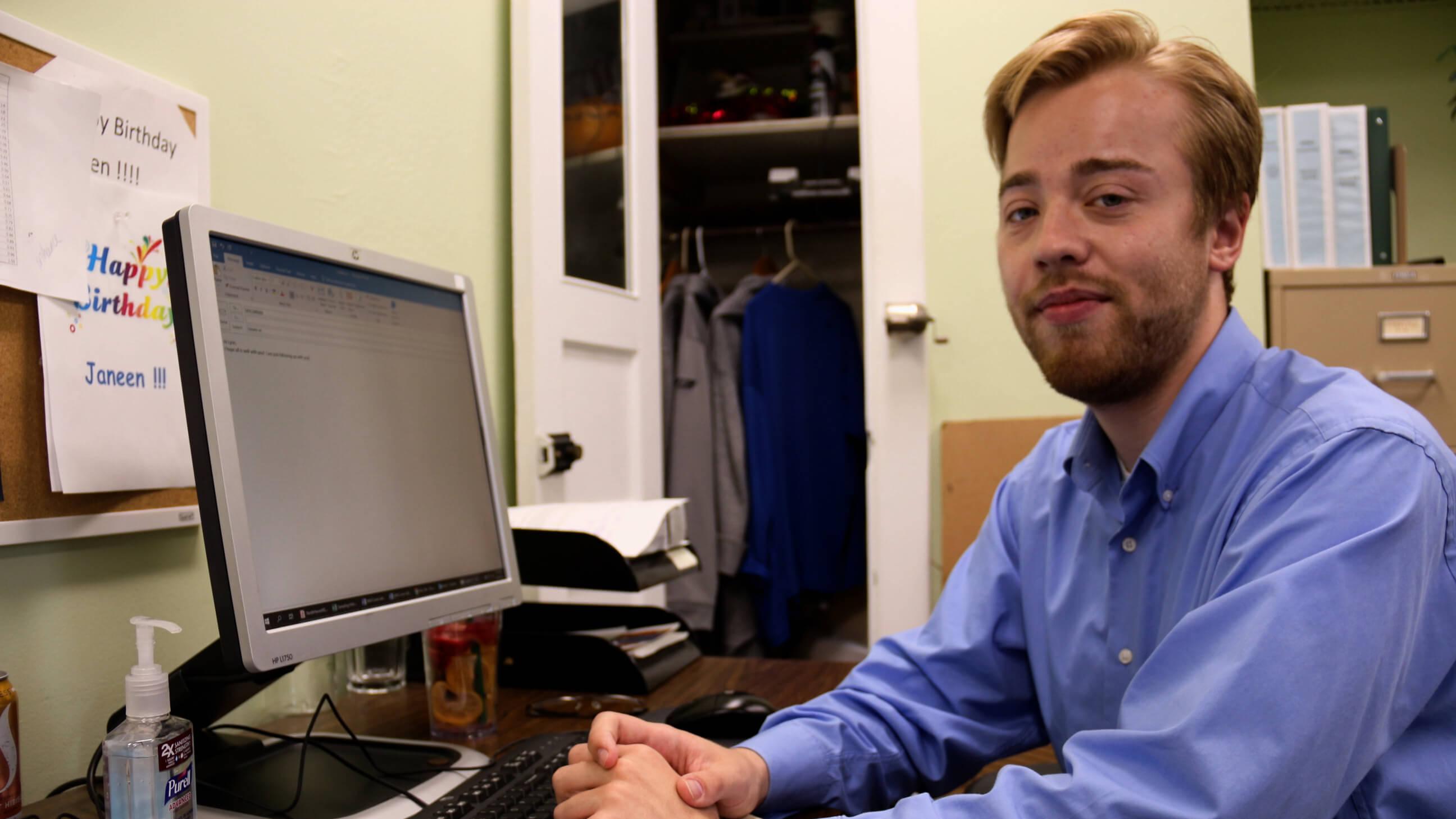 Student fellow sitting at his desk working on projects