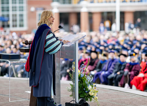 Judy Olian speaks to the crowd at commencement