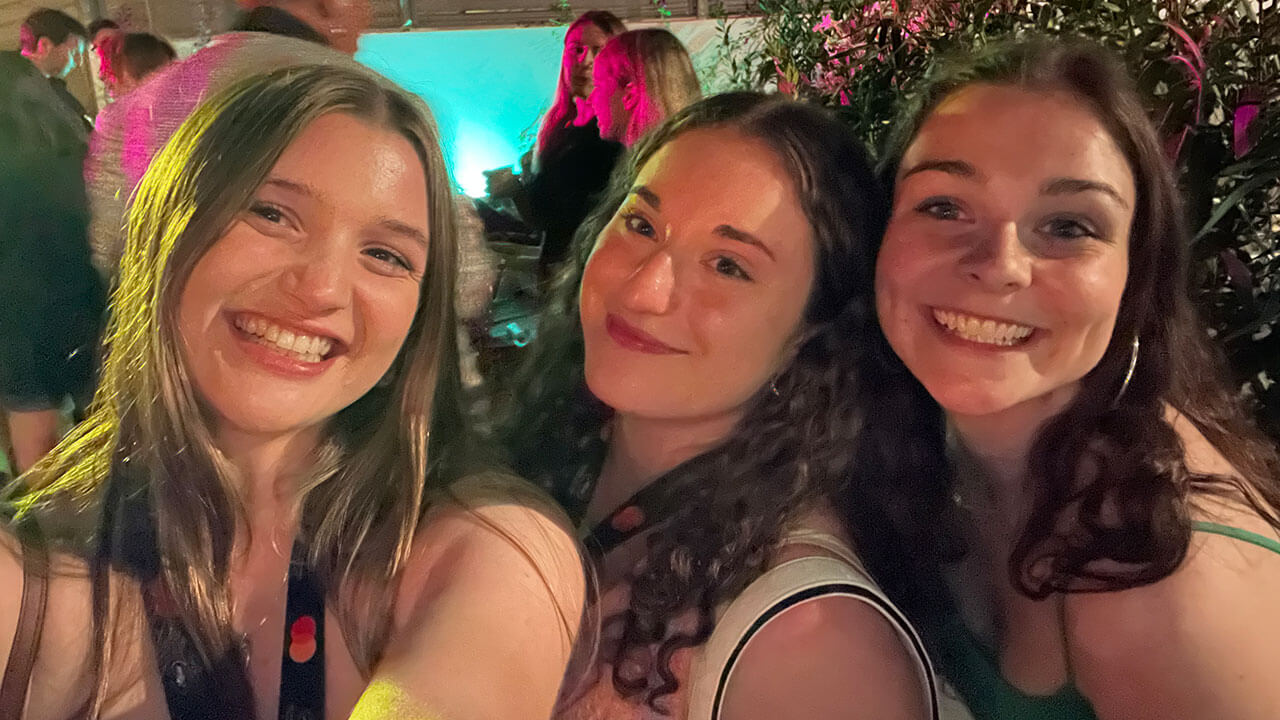 Film students take a selfie while in a movie theater