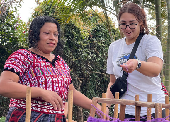 Emily Farley learns to weave traditional Maya clothing during Quinnipiac global learning trip.