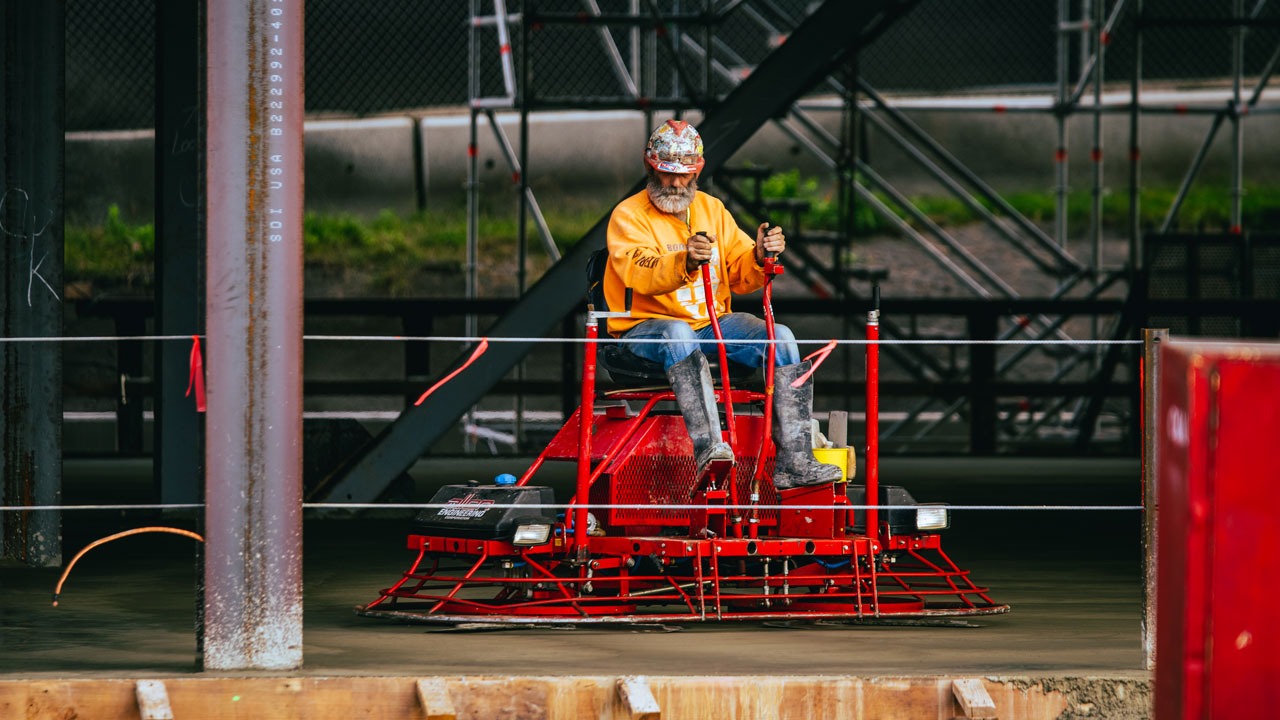 A man operates a construction vehicle.