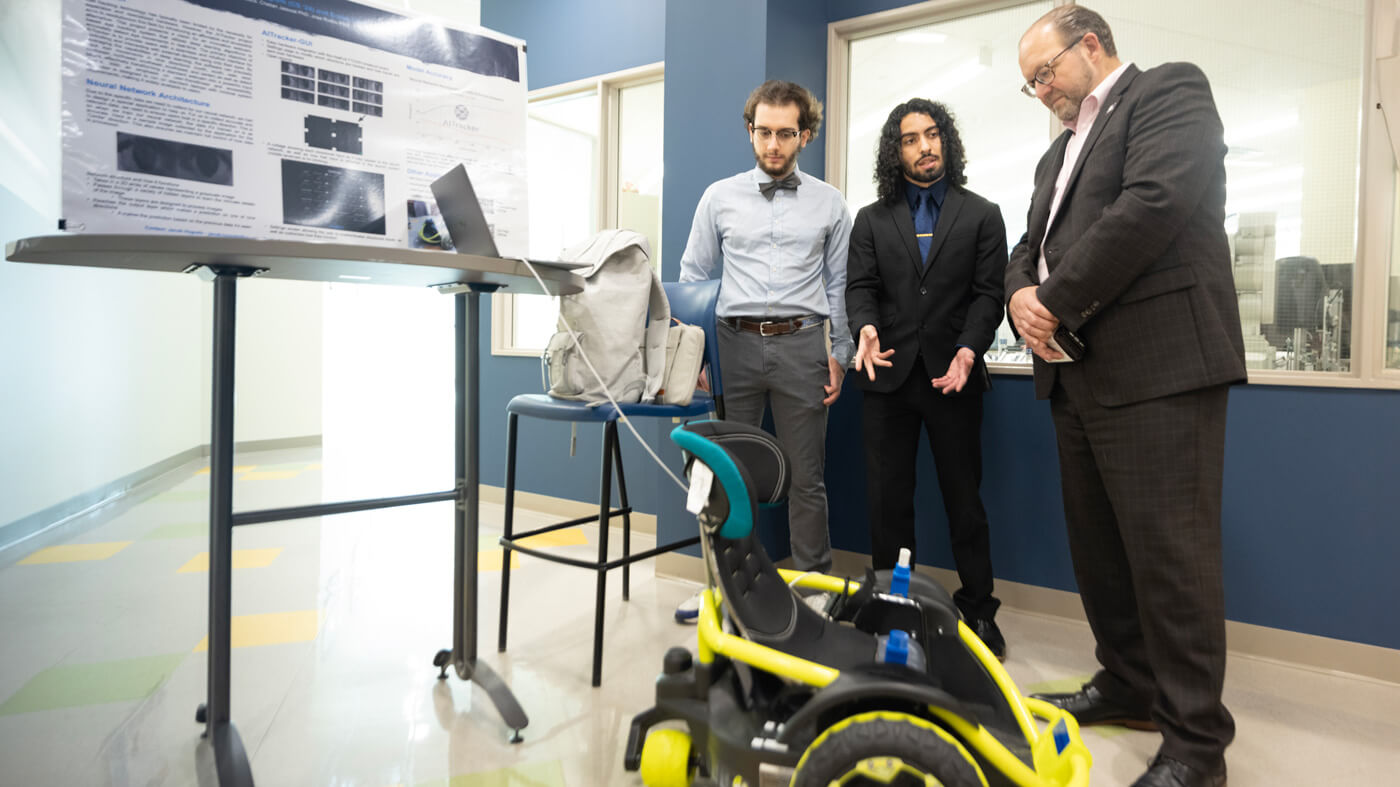 Students present their robot to judges during projects day.