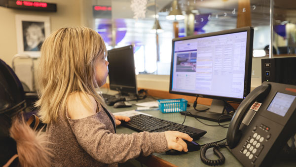 Student employee Alena Galan, a marketing 3+1 graduate , looks up information at the technology center in the Arnold Bernhard Library on Quinnipiac’s Mount Carmel Campus Monday, February, 24, 2020.